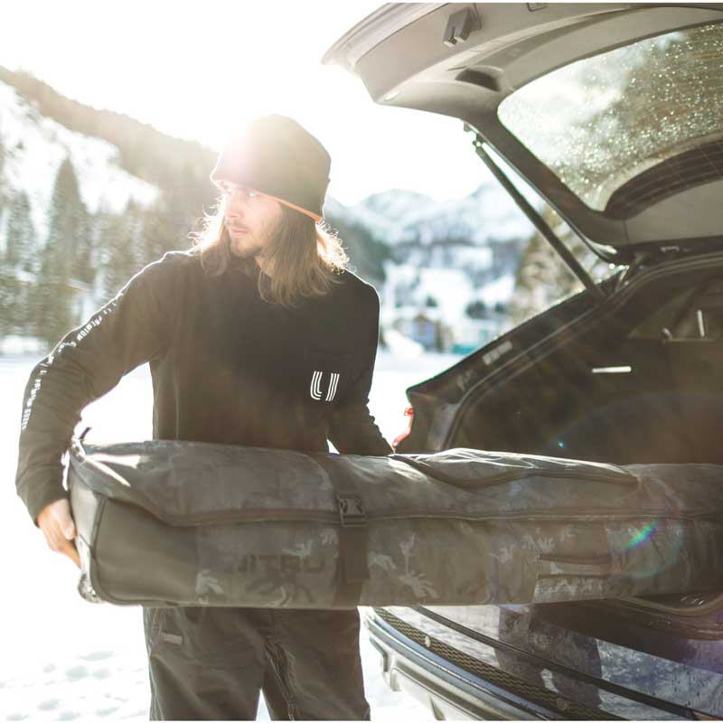 nitro cargo snowboard bag 2026 Board Forged Camo Transport your quiver with confidence using this robust snowboard bag designed to accommodate up to three boards when bindings are removed Nitro Snowboard bag Cargo Board